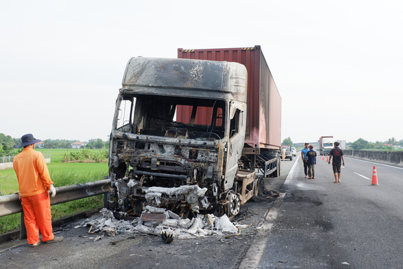 Tractor-trailer catches fire after sideswipe crash on Vietnam expressway